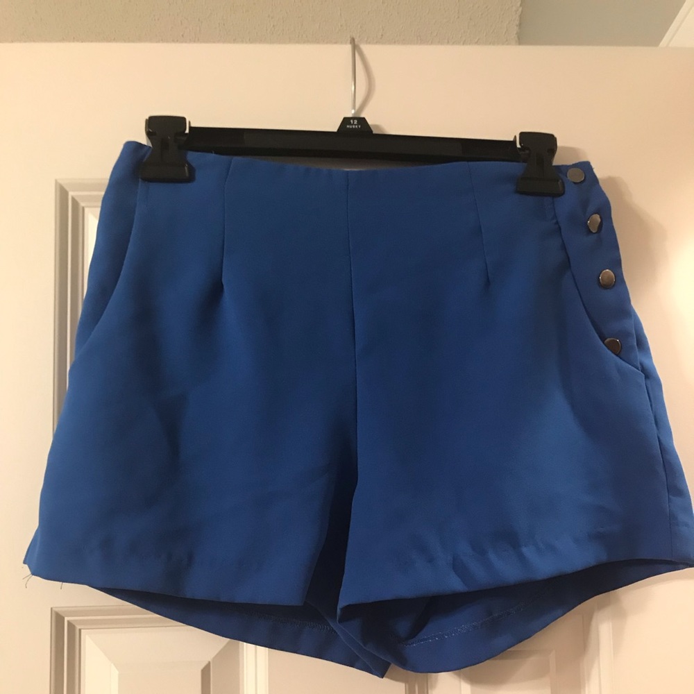 blue formal shorts with snap buttons on the side